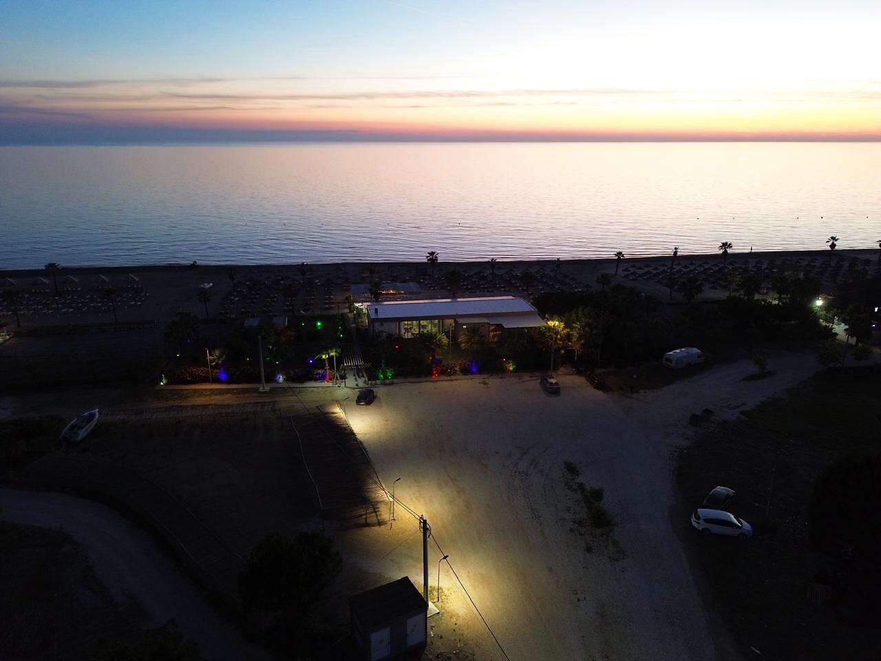 Aisem Park lights at dusk by the sea