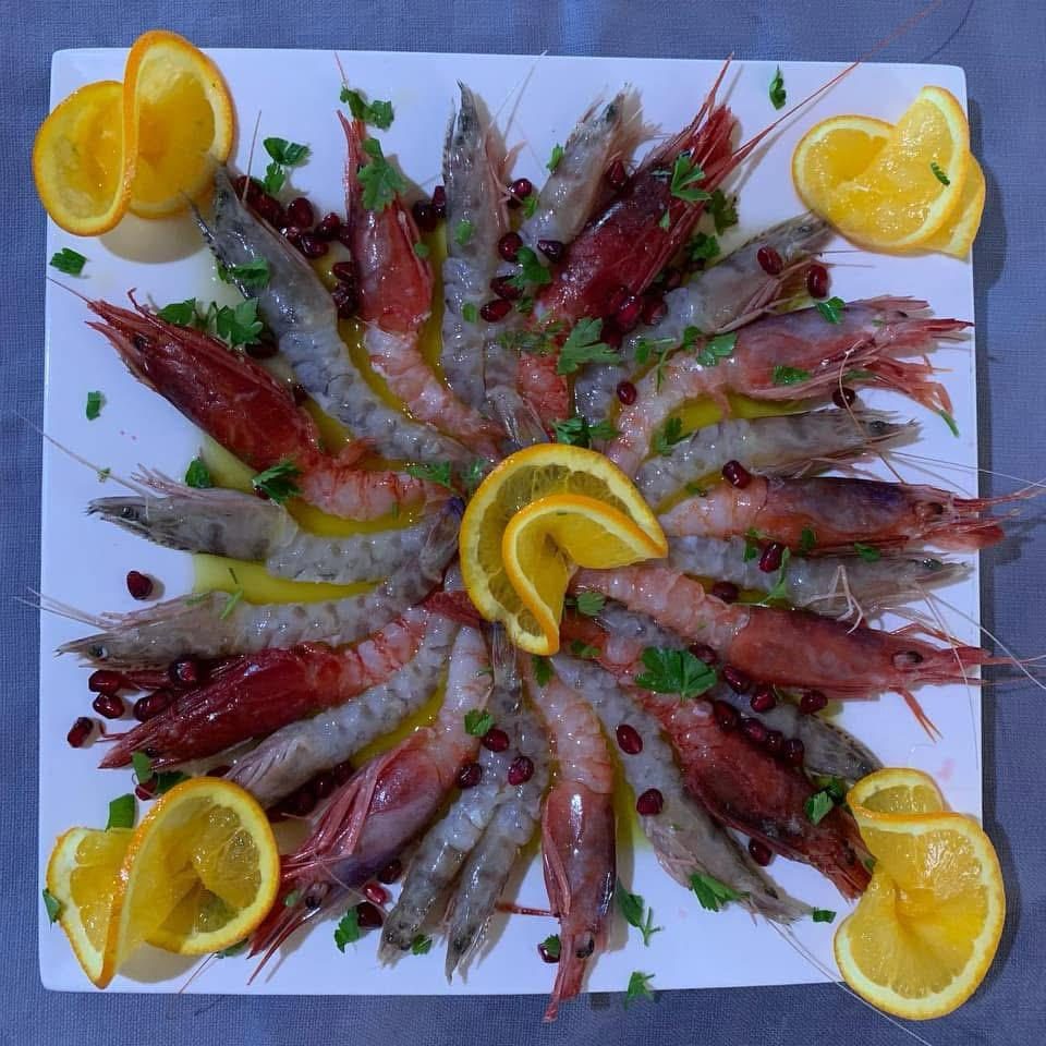 Red prawn crudo with orange and pomegranate