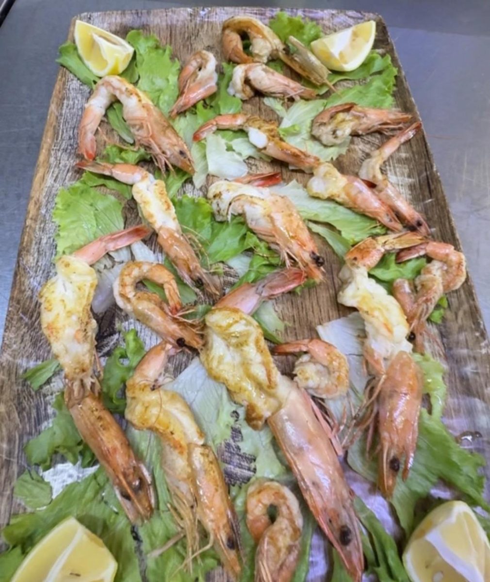 Grilled prawns on a wooden board