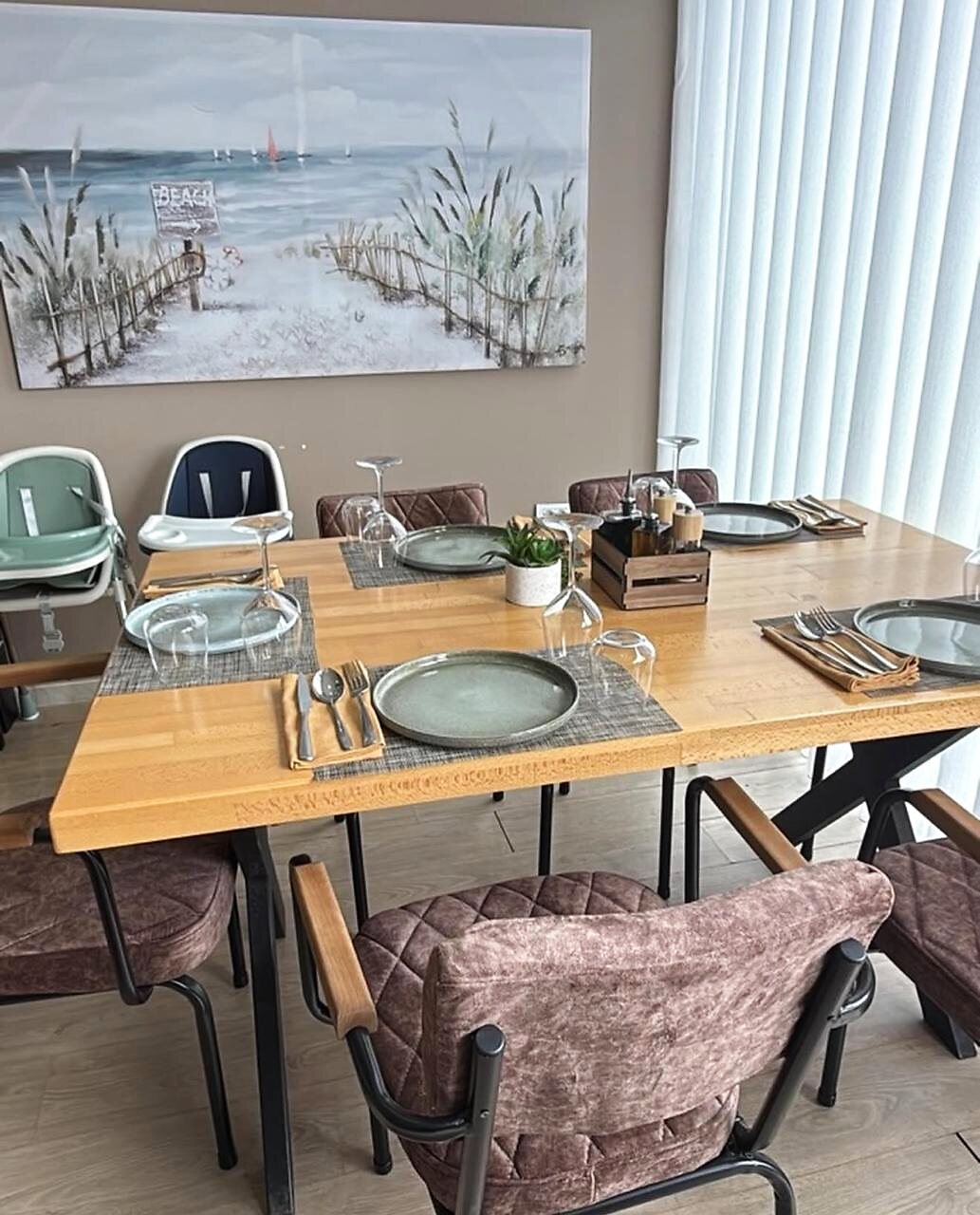 Family table with high chair, ready for guests